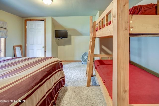 bedroom featuring carpet flooring and baseboards