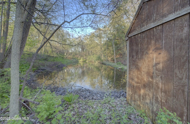 property view of water with a wooded view