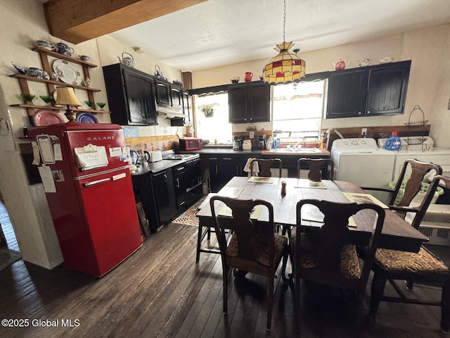 6 Spring St, Johnstown, NY 12095 - kitchen featuring freestanding refrigerator, dark wood-style flooring, washing machine and dryer, under cabinet range hood, and dark cabinets