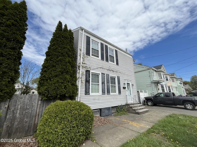 view of front of property featuring fence and entry steps