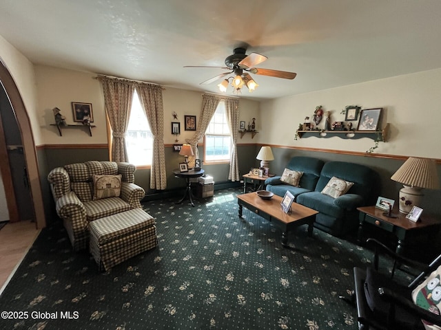sitting room featuring carpet floors and ceiling fan