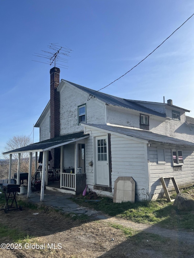 10 Valley View Ln, Moriah, NY 12956 - rear view of property with a chimney