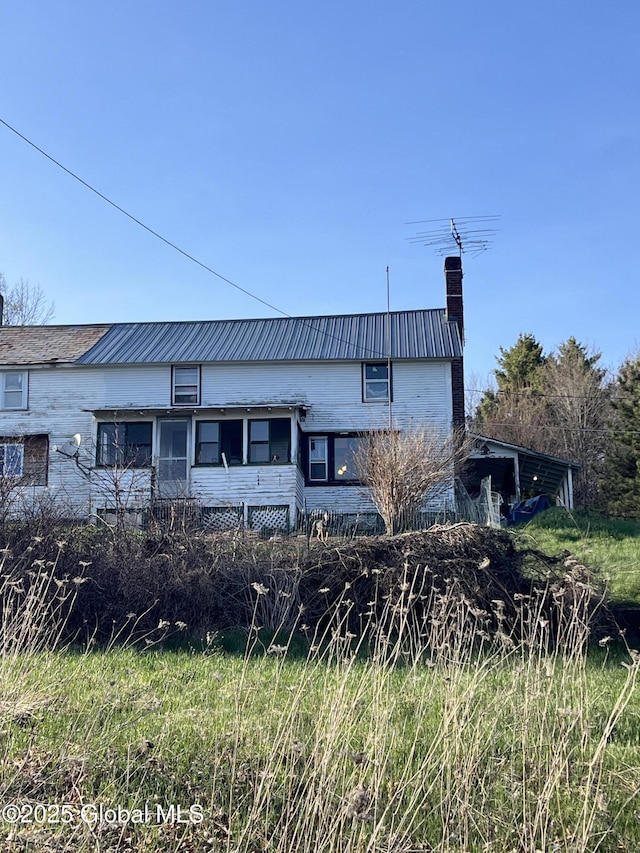 10 Valley View Ln, Moriah, NY 12956 - view of front of property with a chimney and metal roof