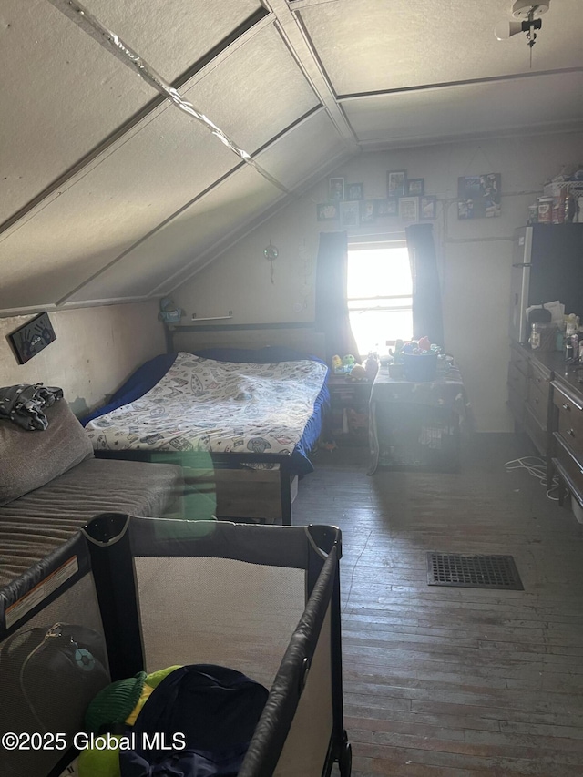 10 Valley View Ln, Moriah, NY 12956 - bedroom with wood-type flooring and vaulted ceiling