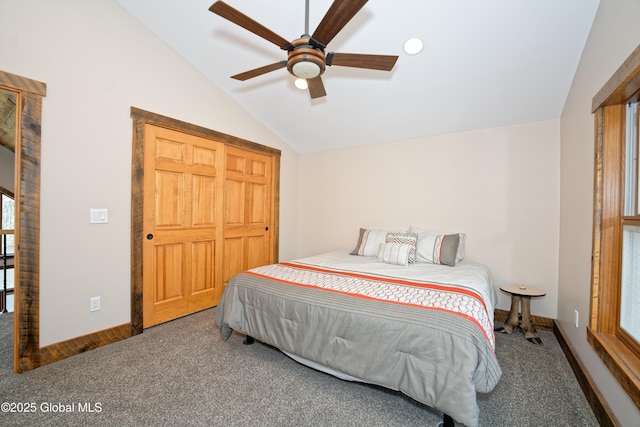 carpeted bedroom with baseboards, vaulted ceiling, and ceiling fan