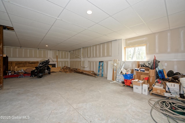 interior space with a paneled ceiling
