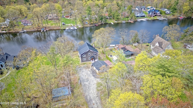drone / aerial view featuring a water view and a residential view