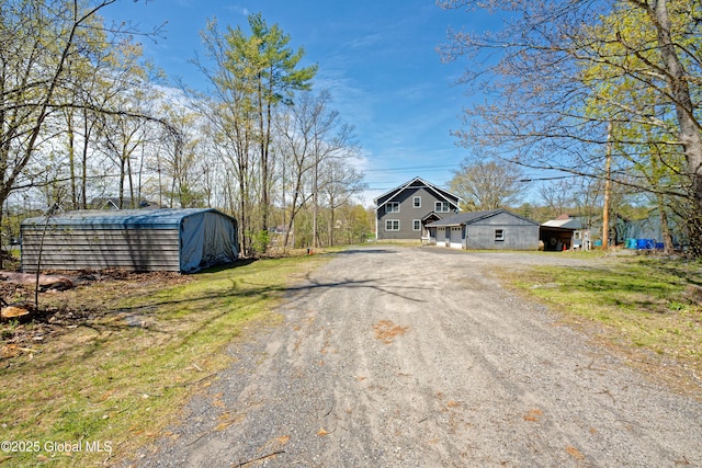 view of street featuring dirt driveway
