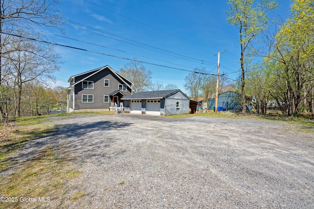 view of front of home with an attached garage and driveway