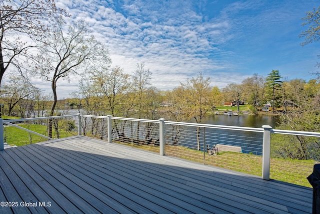 deck featuring a lawn and a water view