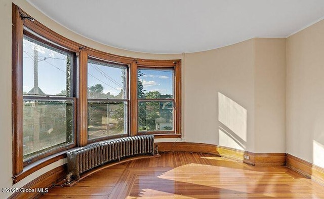 spare room featuring baseboards