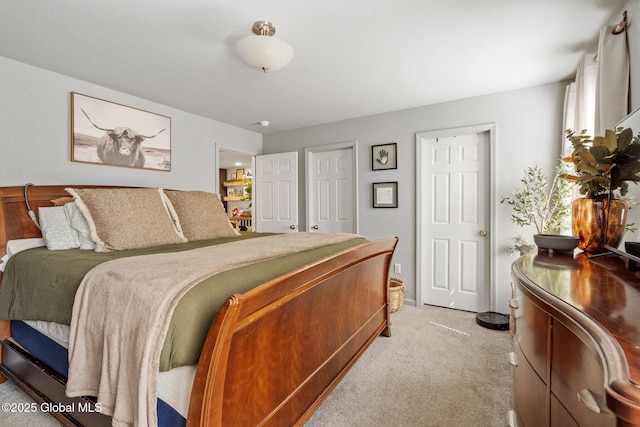 bedroom with light colored carpet