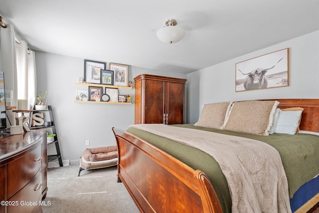 carpeted bedroom featuring baseboards