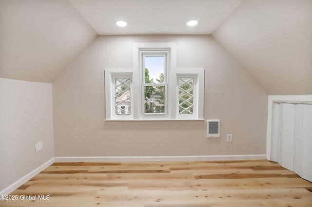 18 Bertha St, Albany, NY 12209 - additional living space featuring lofted ceiling, baseboards, heating unit, and wood finished floors