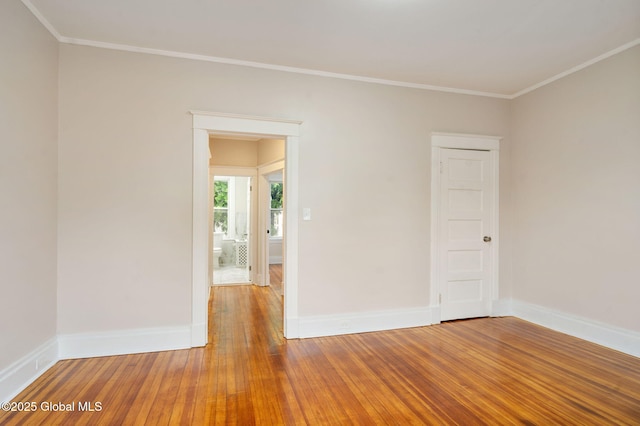 18 Bertha St, Albany, NY 12209 - empty room featuring ornamental molding, wood-type flooring, and baseboards