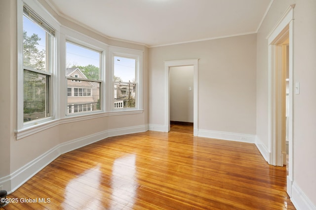18 Bertha St, Albany, NY 12209 - empty room featuring baseboards, light wood finished floors, and crown molding