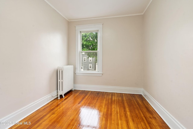 18 Bertha St, Albany, NY 12209 - spare room featuring baseboards, ornamental molding, radiator heating unit, and hardwood / wood-style flooring