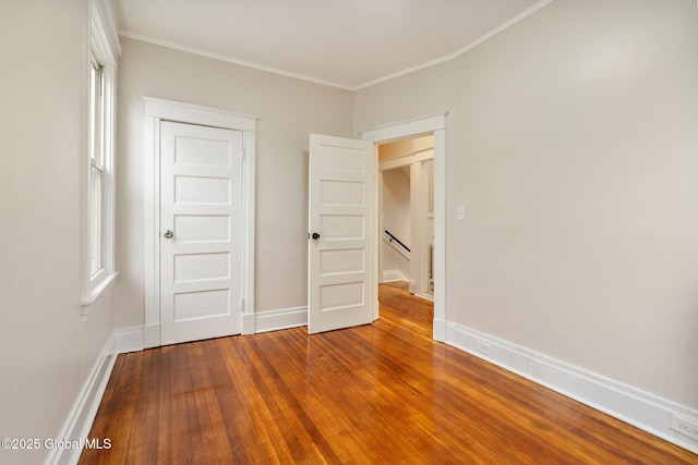18 Bertha St, Albany, NY 12209 - unfurnished bedroom featuring baseboards, dark wood-style flooring, and ornamental molding