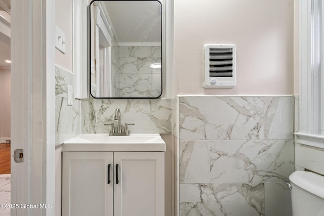18 Bertha St, Albany, NY 12209 - bathroom with heating unit, toilet, and vanity