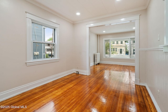 18 Bertha St, Albany, NY 12209 - spare room with crown molding, wood-type flooring, baseboards, and radiator