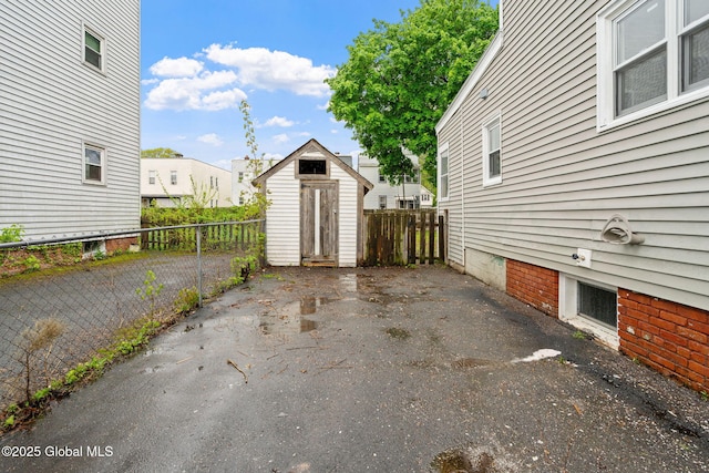 18 Bertha St, Albany, NY 12209 - exterior space with an outbuilding, a residential view, a fenced backyard, and a storage unit