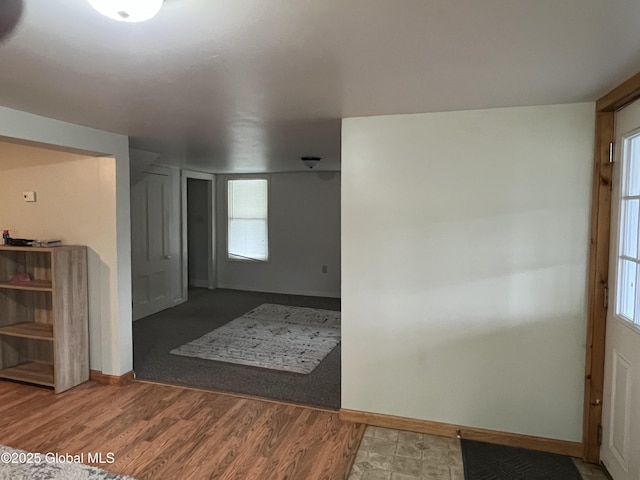 interior space with a healthy amount of sunlight and baseboards