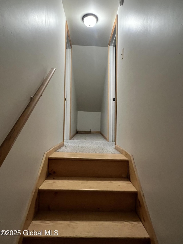 stairway with lofted ceiling