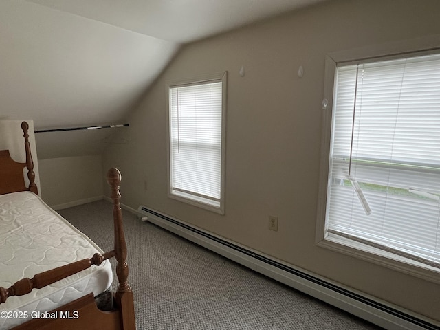 carpeted bedroom featuring baseboards, a baseboard heating unit, vaulted ceiling, and multiple windows