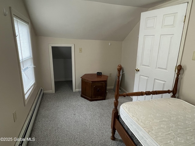 carpeted bedroom with baseboards, multiple windows, vaulted ceiling, and a baseboard heating unit