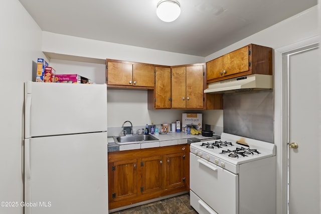 100 3rd St, Waterford, NY 12188 - kitchen with a sink, brown cabinets, under cabinet range hood, and white appliances
