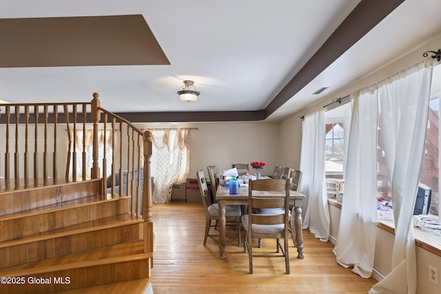 100 3rd St, Waterford, NY 12188 - dining area featuring visible vents, light wood-style flooring, and stairway