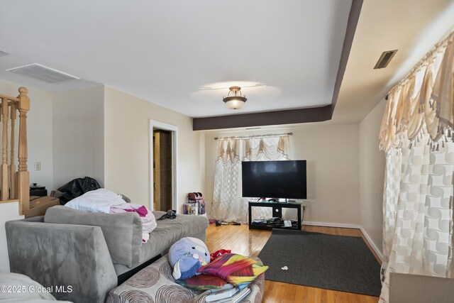 100 3rd St, Waterford, NY 12188 - living room featuring visible vents and wood finished floors