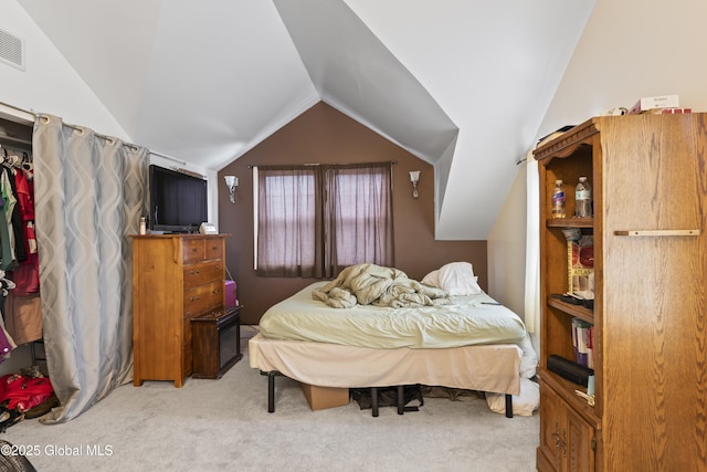 100 3rd St, Waterford, NY 12188 - bedroom featuring visible vents, lofted ceiling, and light carpet