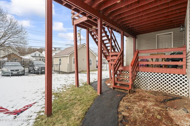 100 3rd St, Waterford, NY 12188 - snow covered deck with fence, stairs, and a residential view