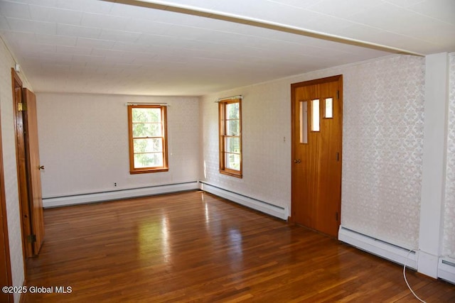 entrance foyer with a baseboard heating unit and wood finished floors
