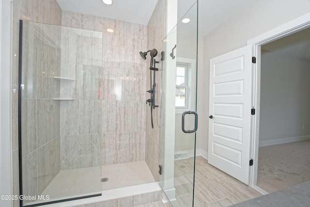 full bath with baseboards, recessed lighting, and a stall shower