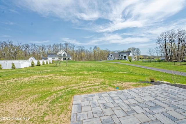 view of yard with fence and a patio area