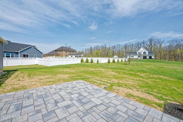 view of yard with a patio and fence