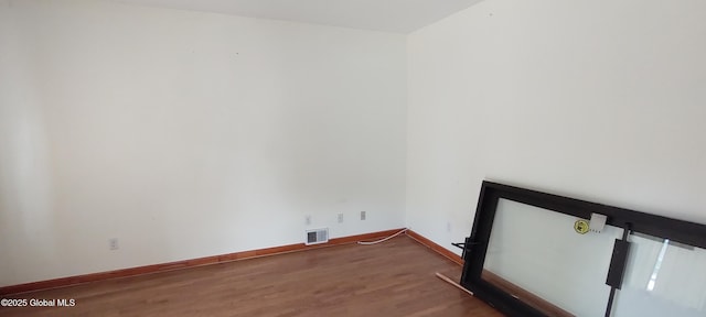 55 Watervliet Ave, Albany, NY 12206 - laundry area with baseboards, visible vents, and wood finished floors