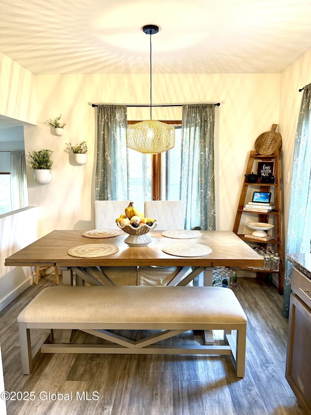 dining room featuring wood finished floors and breakfast area