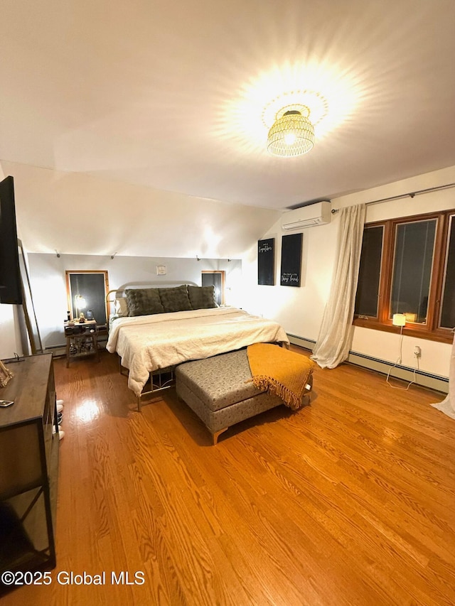 bedroom featuring an AC wall unit, wood finished floors, lofted ceiling, and a baseboard radiator