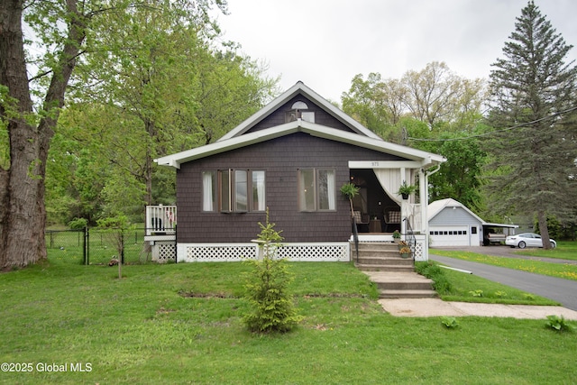 975 Riverview Rd, Schenectady, NY 12309 - bungalow-style house featuring a garage and an outbuilding