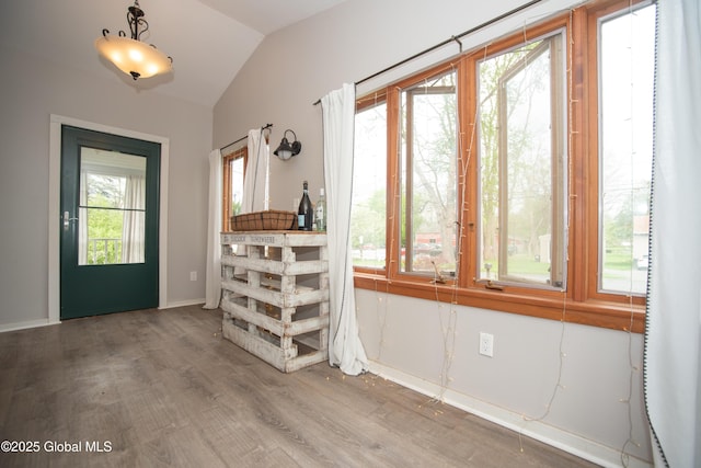 975 Riverview Rd, Schenectady, NY 12309 - foyer entrance with wood finished floors, vaulted ceiling, and baseboards