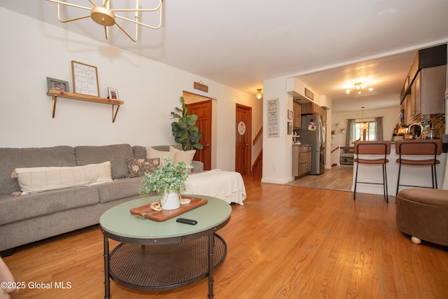975 Riverview Rd, Schenectady, NY 12309 - living area with light wood-type flooring and stairway