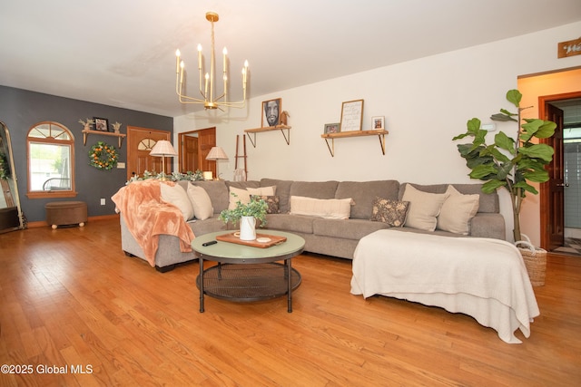 975 Riverview Rd, Schenectady, NY 12309 - living area featuring light wood finished floors and a chandelier