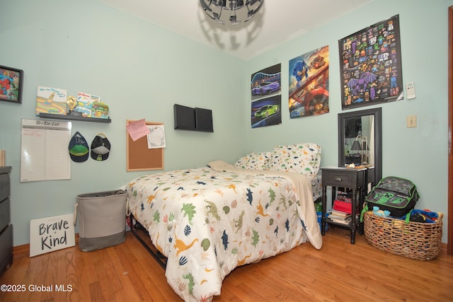 975 Riverview Rd, Schenectady, NY 12309 - bedroom featuring wood finished floors and a chandelier