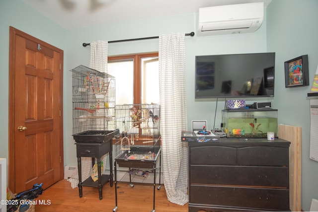 975 Riverview Rd, Schenectady, NY 12309 - bedroom with a wall unit AC and wood finished floors