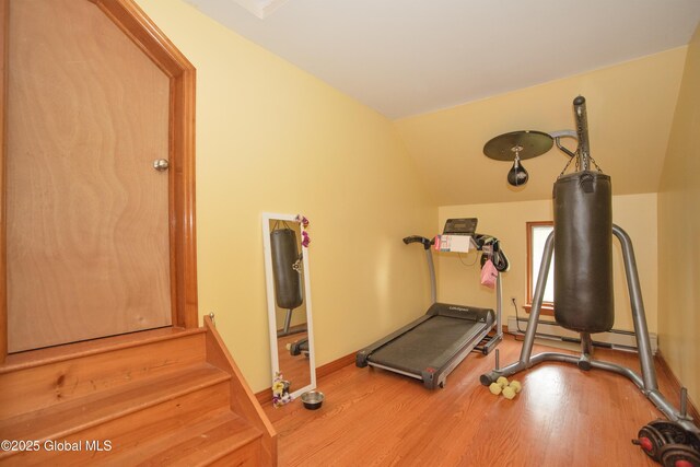 975 Riverview Rd, Schenectady, NY 12309 - workout room featuring wood finished floors, lofted ceiling, a baseboard radiator, and baseboards