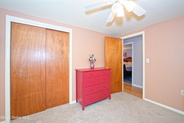20 Limerick Ln, Ballston Spa, NY 12020 - bedroom featuring a closet, light carpet, ceiling fan, and baseboards