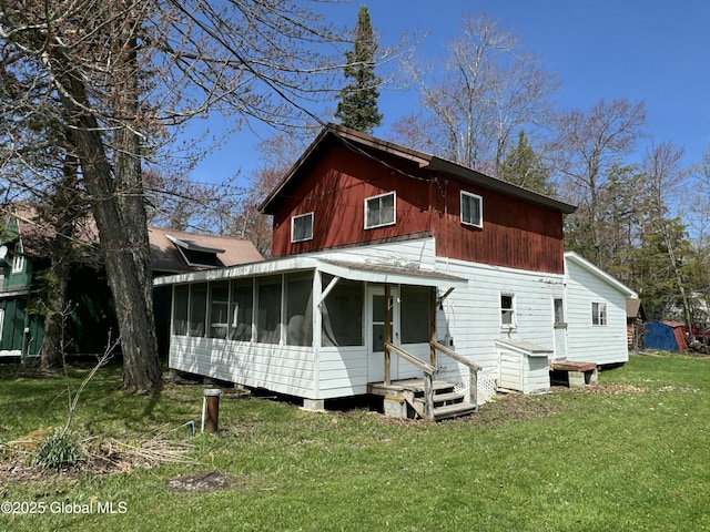 113 Forest Ave, Caroga, NY 12032 - back of house with a sunroom, a lawn, and entry steps
